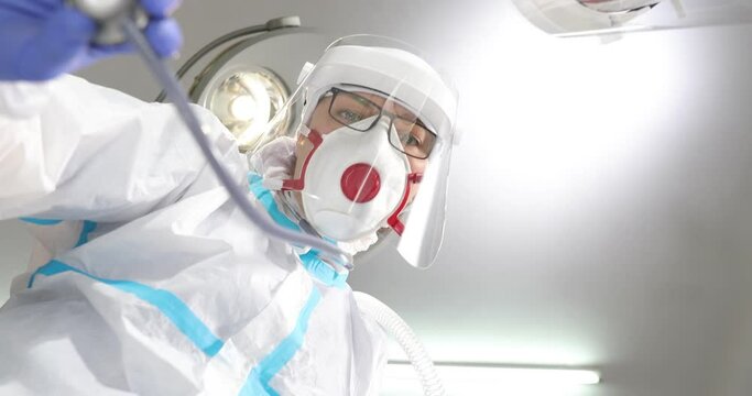 Anesthesiologist Doctor Putting Mask Patient Face, Low Angle Shot POV Patient View: Doctors And Covid-19 Patient With Oxygen Mask In Bed In Hospital, Coronavirus Concep.