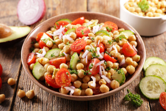 chickpea salad with tomato, cucumber, avocado and onion