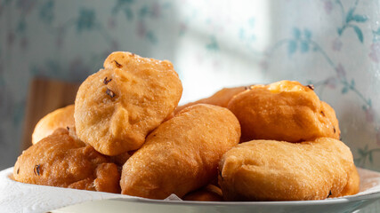 fried country pies. rustic cuisine. pies with potatoes on a plate