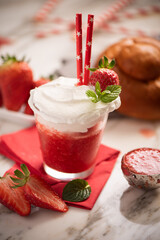 A delicious breakfast with strawberry granita and brioches, sicily