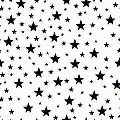 Seamless pattern with black stars on a white background. Doodle vector illustration.