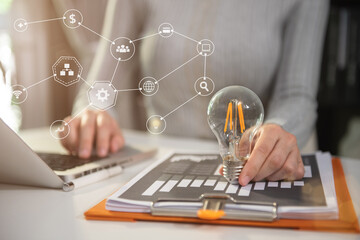 Businesswoman thinking ideas strategy working concept at the desk in the office.