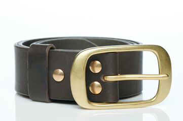 Metal buckle on brown leather belt