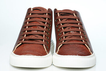 Front view of pair leather keds