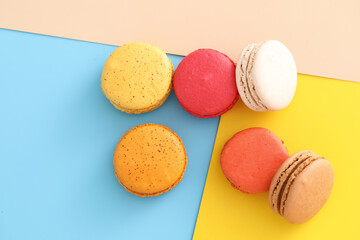 Colorful macarons isolated in pastel background