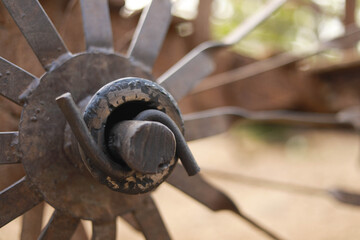 Some Photos of Old indian iron bullock cart in green farm. Vintage style iron bullock cart in rusty brown colour with pleasant sky.