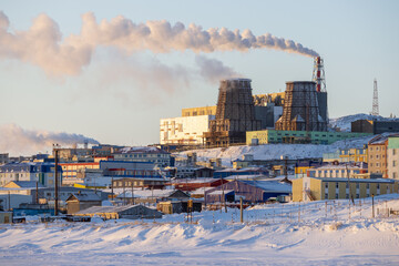 Industrial Arctic landscape. View of a large thermal power plant on the hill. Smoke over tall industrial chimneys. Industry and ecology of the polar region. Anadyr, Chukotka, Siberia, Far North Russia © Andrei Stepanov