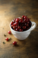 Fresh gooseberry in a white cup