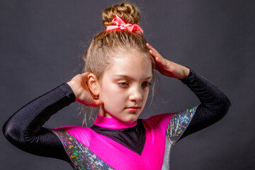 Portrait of a little pensive cheerleader girl