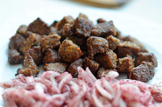 Pan fried beef liver with seasoned onion salad