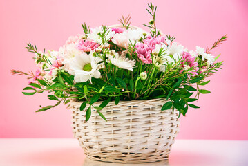 Bunch of fresh summer flowers on the pink background