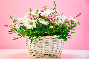 Bunch of fresh summer flowers on the pink background