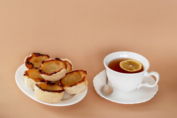 Portuguese custard tarts Pastel de nata with a cup of tea.