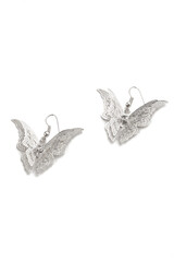 Subject shot of two hook silver earrings decorated with pendants made as fancy butterflies with lace wings. The pair of fantasy earrings is isolated on white background.