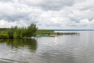 Two fishing boats on the lake shore