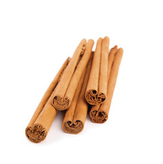 Aromatic dry cinnamon sticks on white background