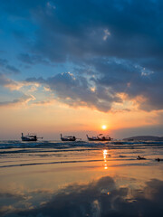 Traditional thai boats at sunset beach. Ao Nang Krabi province