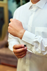 Handsome elegant young fashion man in coat tuxedo classical costume suit