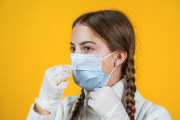 girl child wearing respirator mask to protect from coronavirus, safe