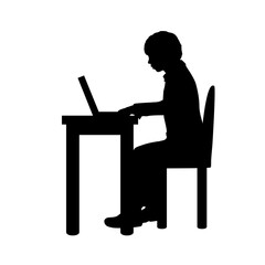 Silhouette boy sitting by computer