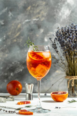 Aperol spritz Cocktail drink. Alcoholic beverage with bloody oranges, red bitter, dry white wine,...