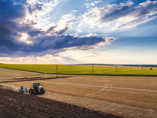 Tractor plowing the fields