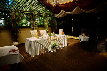 Wedding table in rustic style, decorations made of wood and wildflowers served
