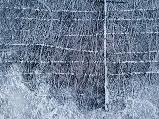 Frosty pattern on the river. Aerial drone view. Sunny winter day, thin ice on the river.