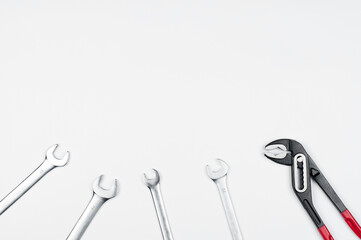 Wrench. Open-end wrenches. Pliers for plumbing. Tool. On a white background.
