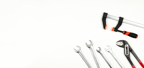 Wrench. Open-end wrenches. Iron clamps. Tool. Clamps and vices. On a white background.