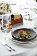 Salad of avokado, seafood, meat, vegetables and pumpkin seeds. Dietary, wholesome and tasty. Banquet festive dishes. Gourmet restaurant menu. White background.