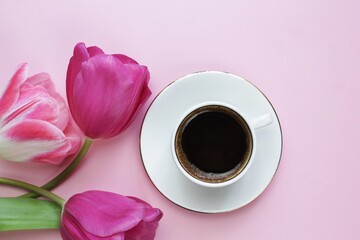 cup of coffee with tulips