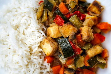vegetable asian meal tofu and vegetables stir fried with white rice