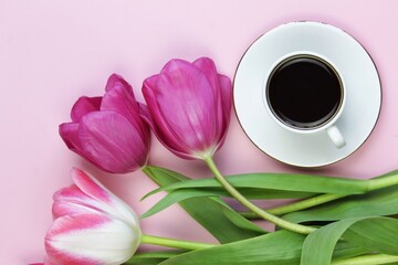 cup of coffee with tulips