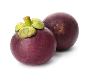 Delicious ripe mangosteen fruits on white background
