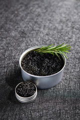 Fish black caviar on a dark stone