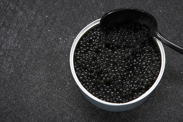 Closeup of spoon with black caviar