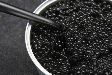 Closeup of spoon with black caviar