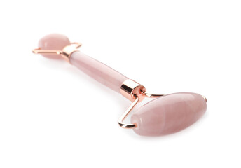 Rose quartz face roller on white background