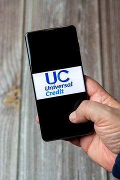 03-10-2021 Portsmouth, Hampshire, UK A Mobile Phone Or Cell Phone Being Held In A Hand With The Universal Credit App Open On Screen