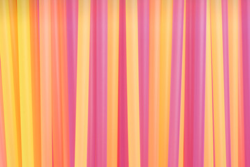 Heap of colorful plastic straws for drinks as background, closeup