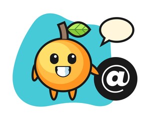 Orange fruit cartoon standing beside the At symbol