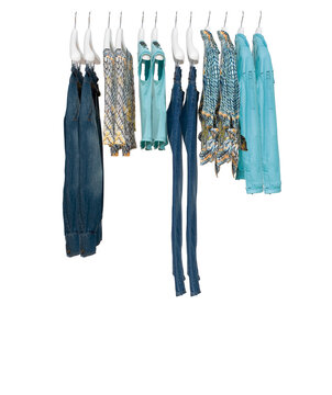 Elegant and trendy clothes for women hanging.
