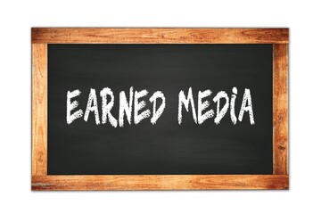 Obraz premium EARNED MEDIA text written on wooden frame school blackboard.