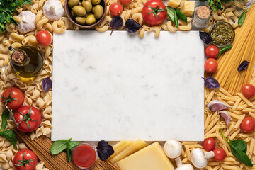 Italian food  background. Variety of pasta, tomatoes, olive oil, tomato and pesto sauce, red basil, garlic, cheese on light background. Mediterranean cuisine concept