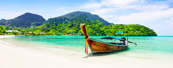 Panorama of thai traditional wooden longtail boat and beautiful sand beach. - obrazy, fototapety, plakaty