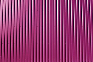 Ridged pink metal wall background.