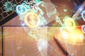 Stock market graph and top view computer on the table background. Multi exposure. Concept of financial education.