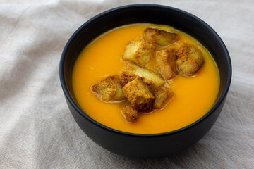 Pumpkin soup served with croutons