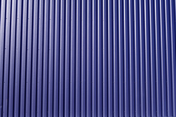 Ridged blue metal wall background.